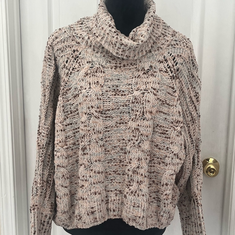 Women’s size medium turtleneck sweater.